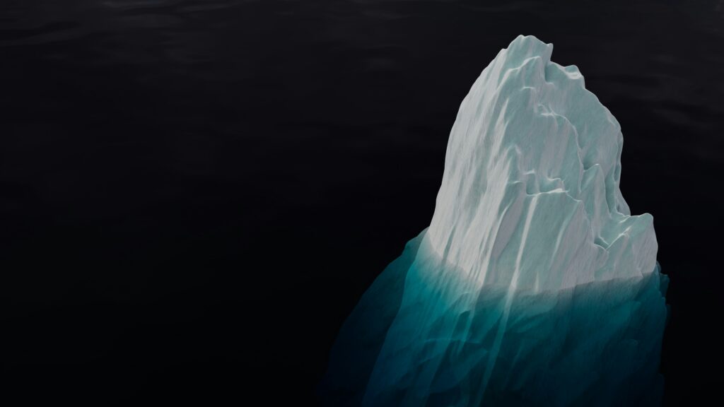 an iceberg in black water